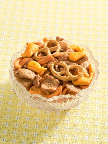 Dish of Toffee Nuts, Pretzels & Crackers on Table