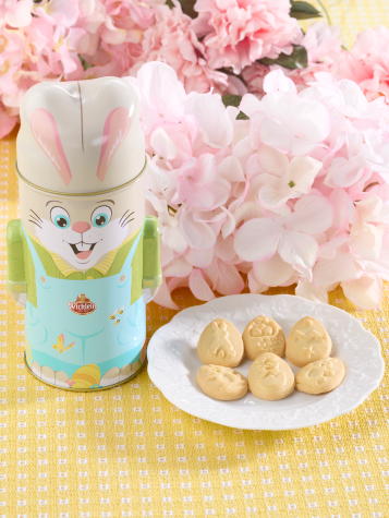 Easter Bunny-shaped tin with egg-shaped cookies.