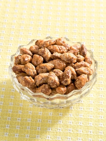 Bowl of Buttery Toffee Coated Almonds on Table