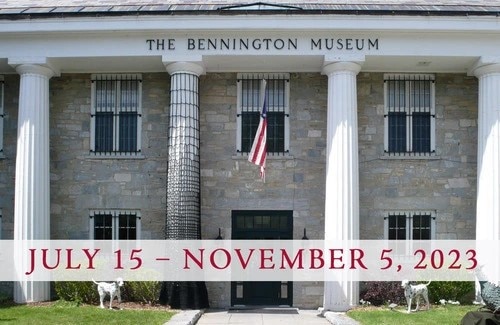 The front of the Bennington Museum with a date banner July 15 - November 5, 2023